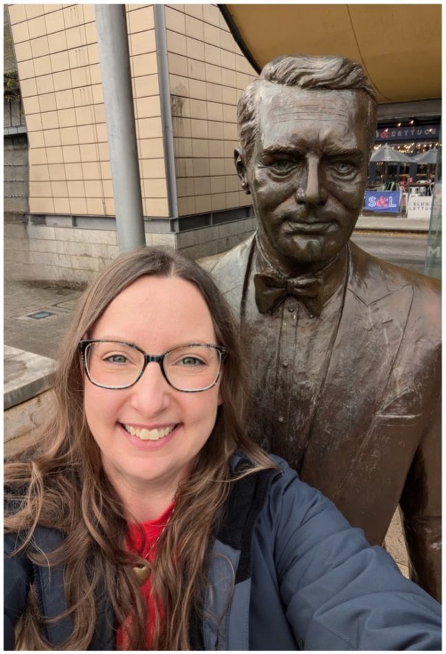 Cate Bryan next to the Cary Grant Statue in Millennium Square Bristol on her visit to the 2024 festival!